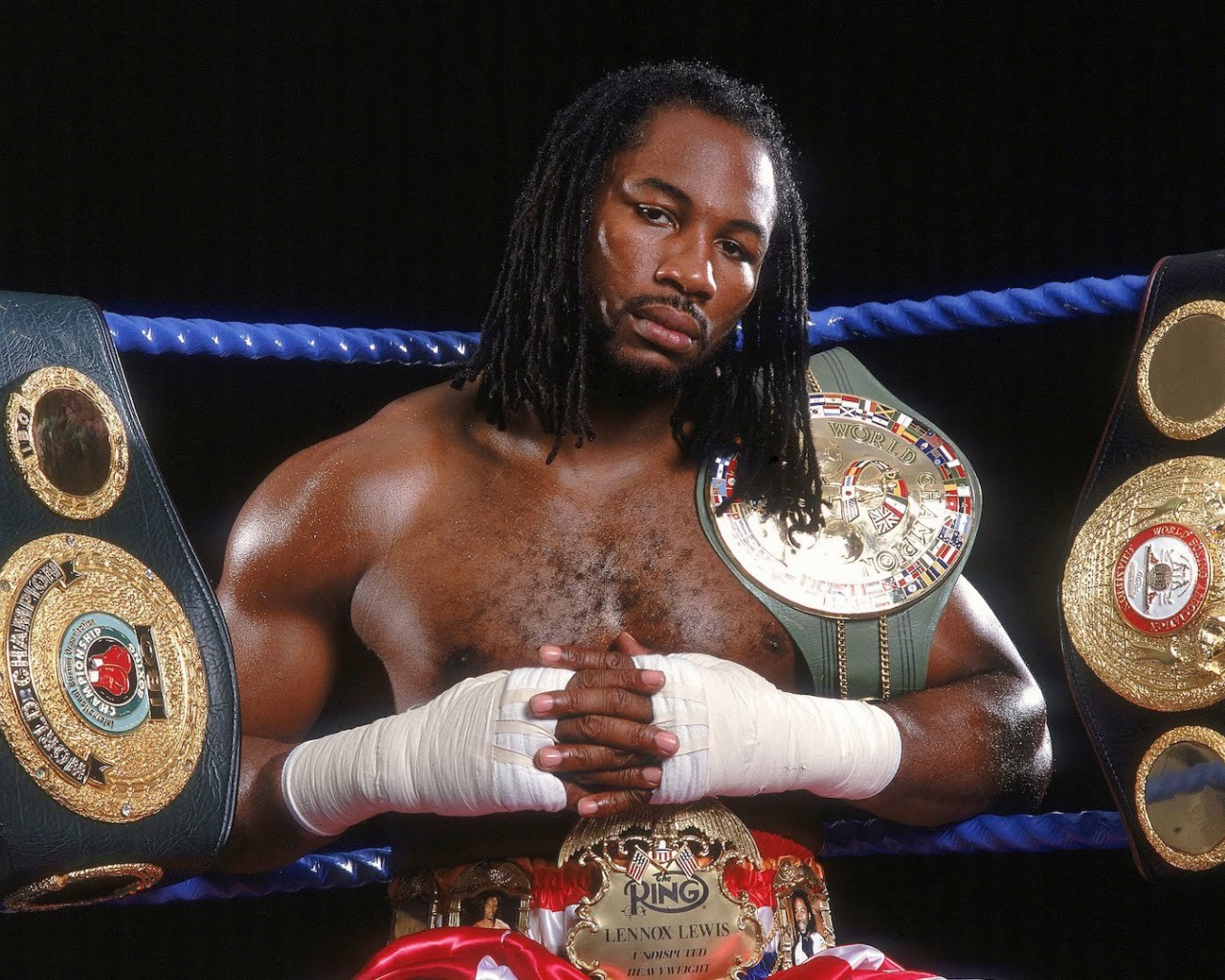 Champion Lennox Lewis and his belts