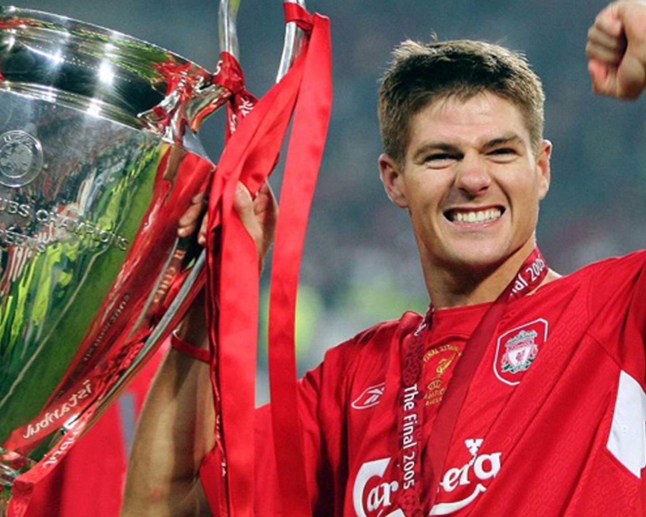 The football player of Liverpool Steven Gerrard with his own trophy