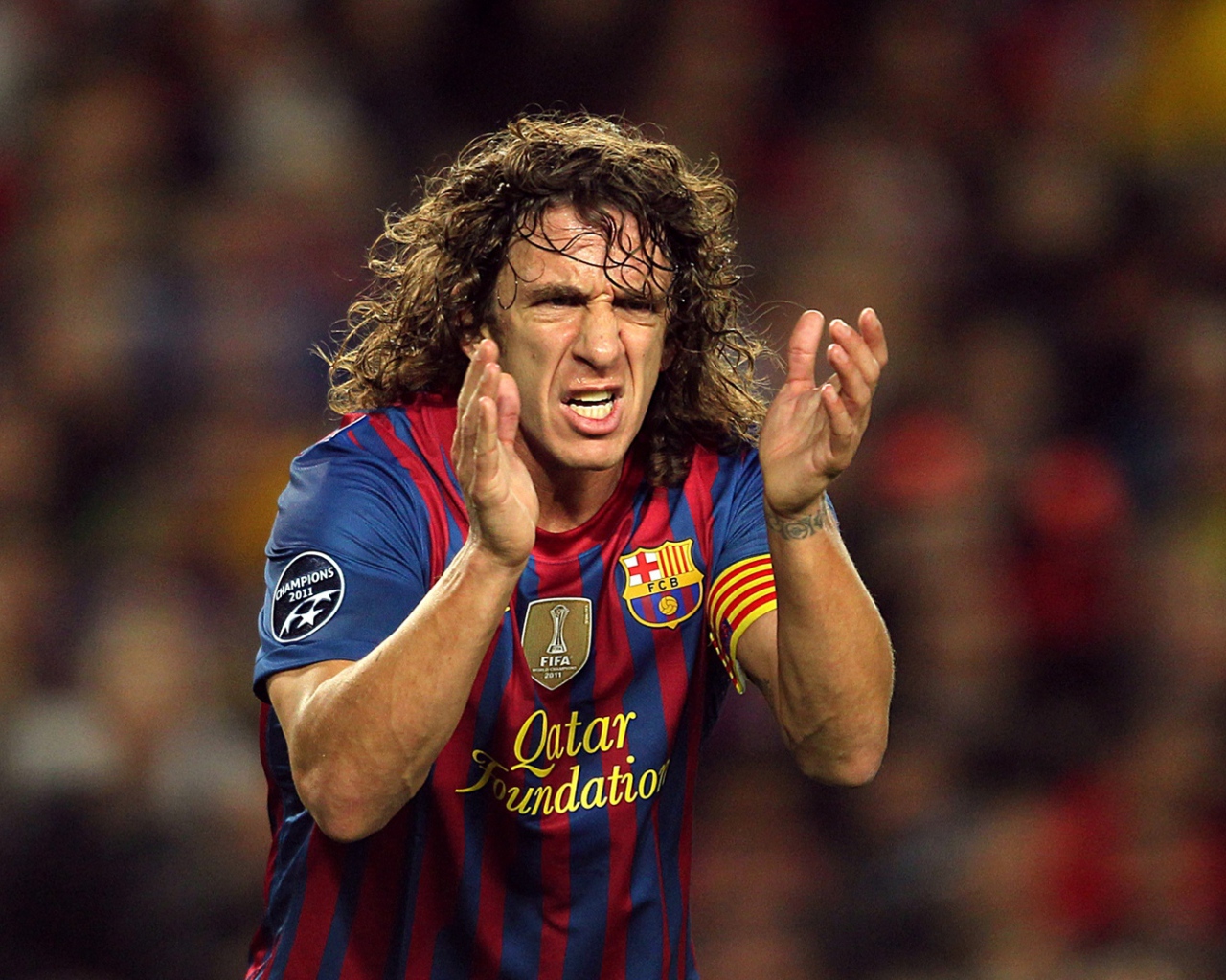 The player of Barcelona Carles Puyol applauding