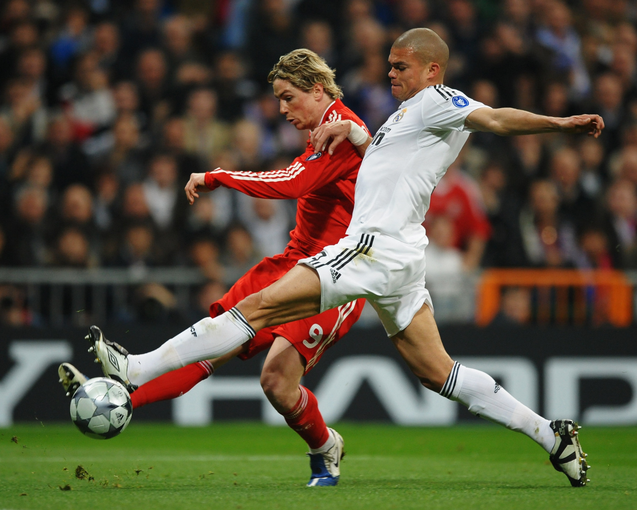 The player of Real Madrid Pepe trying to take the ball
