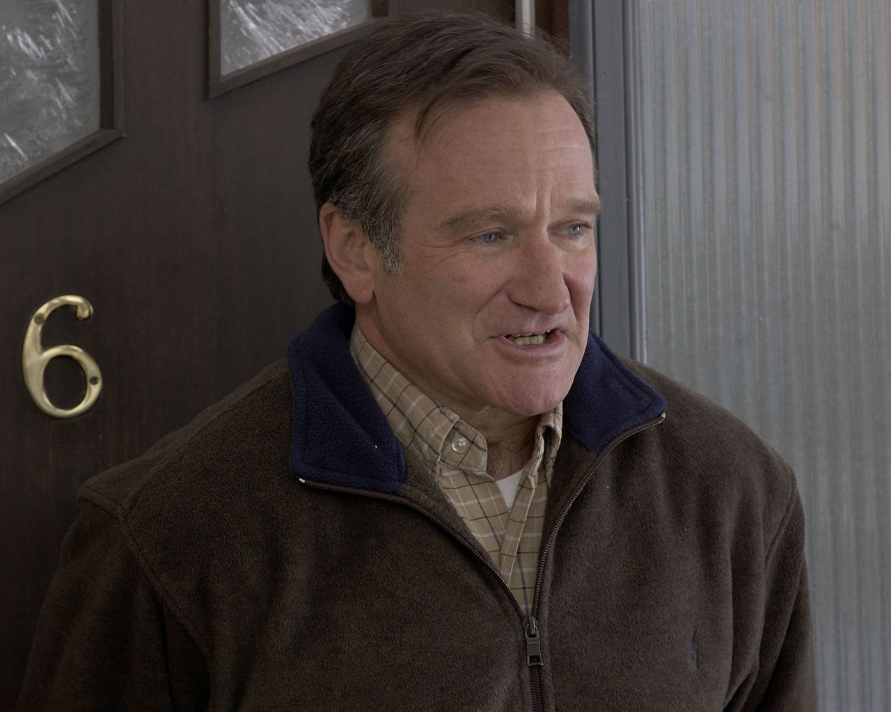 Актер Робин Уильямс у двери