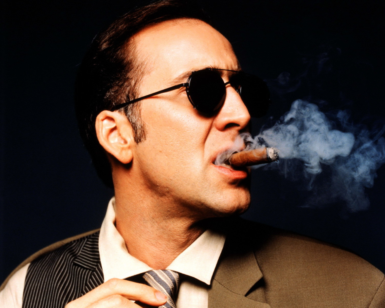 Nicolas Cage is smoking cigar
