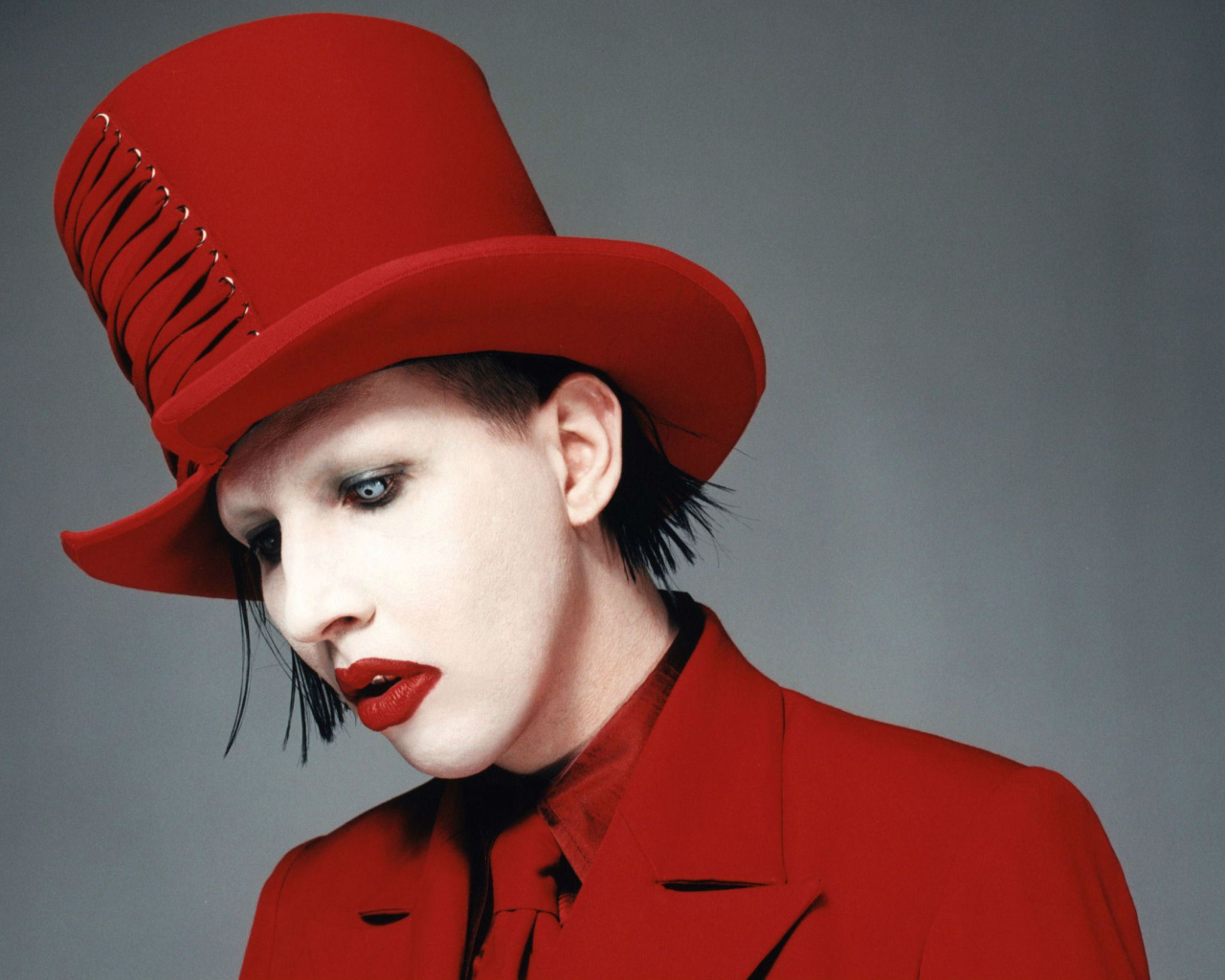 Marilyn Manson in a red hat