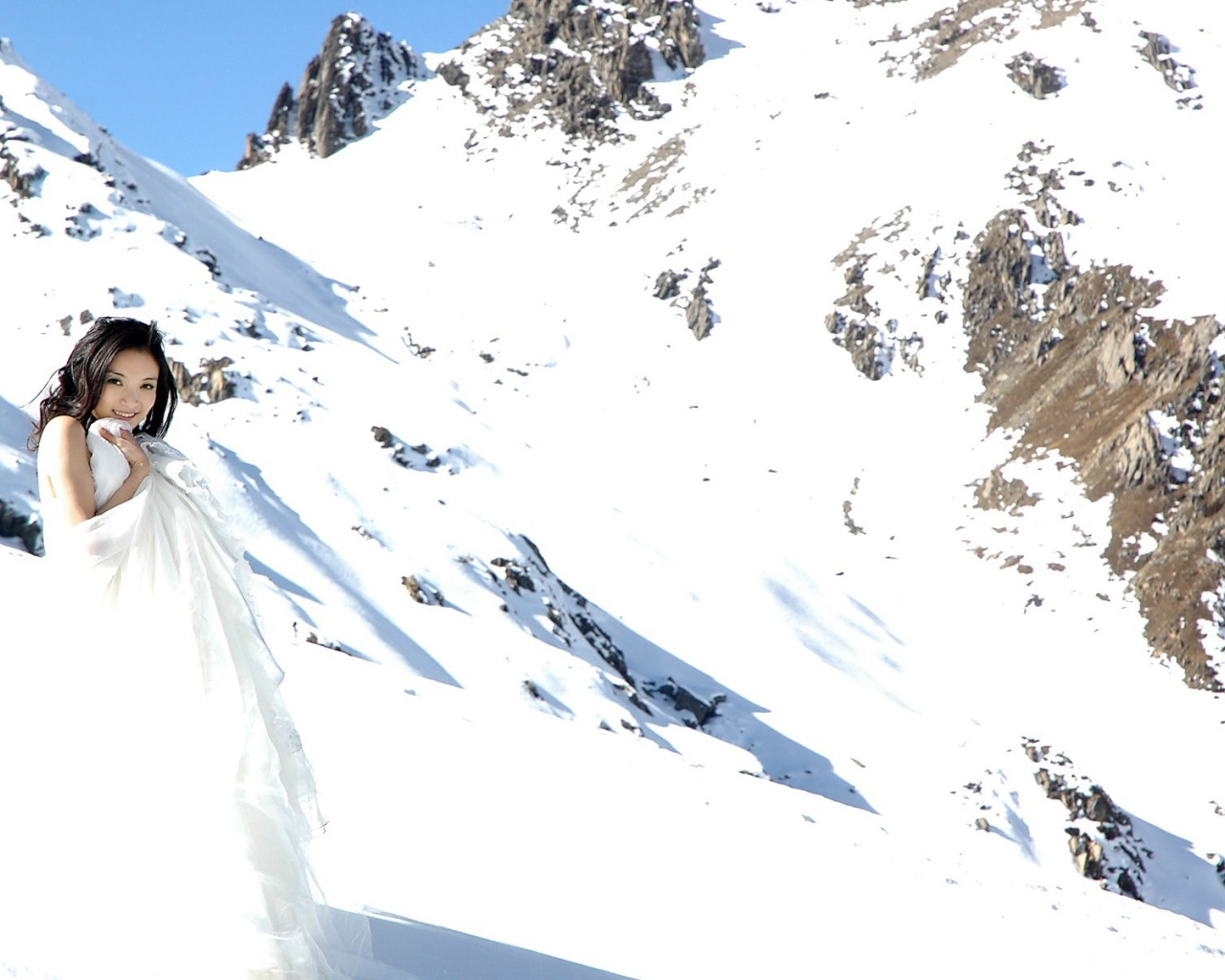 The bride in the snowy mountains