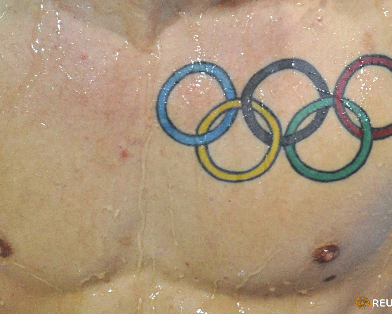 Олимпийские кольца татуировка
