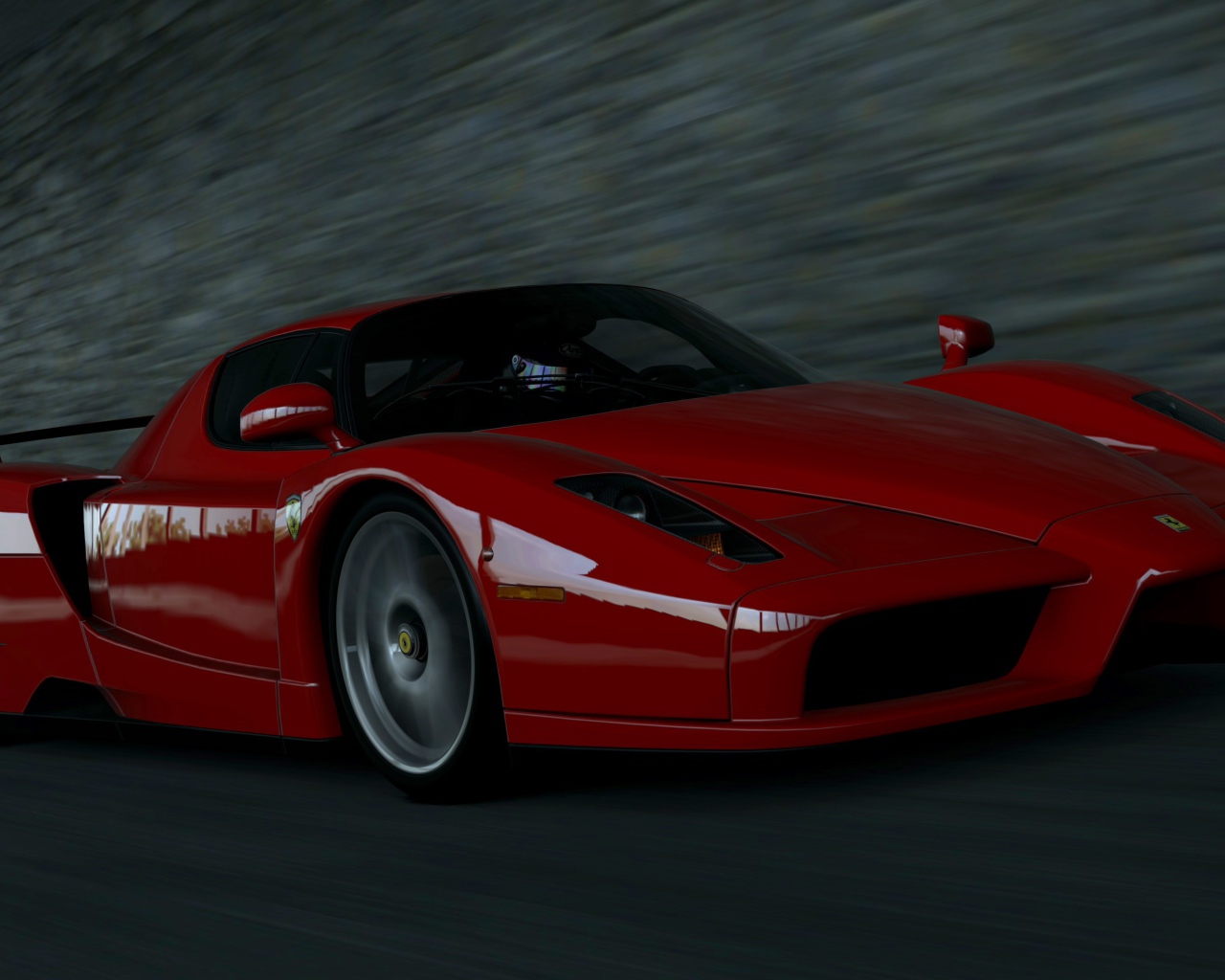 Красный Ferrari Enzo мчится на черном фоне