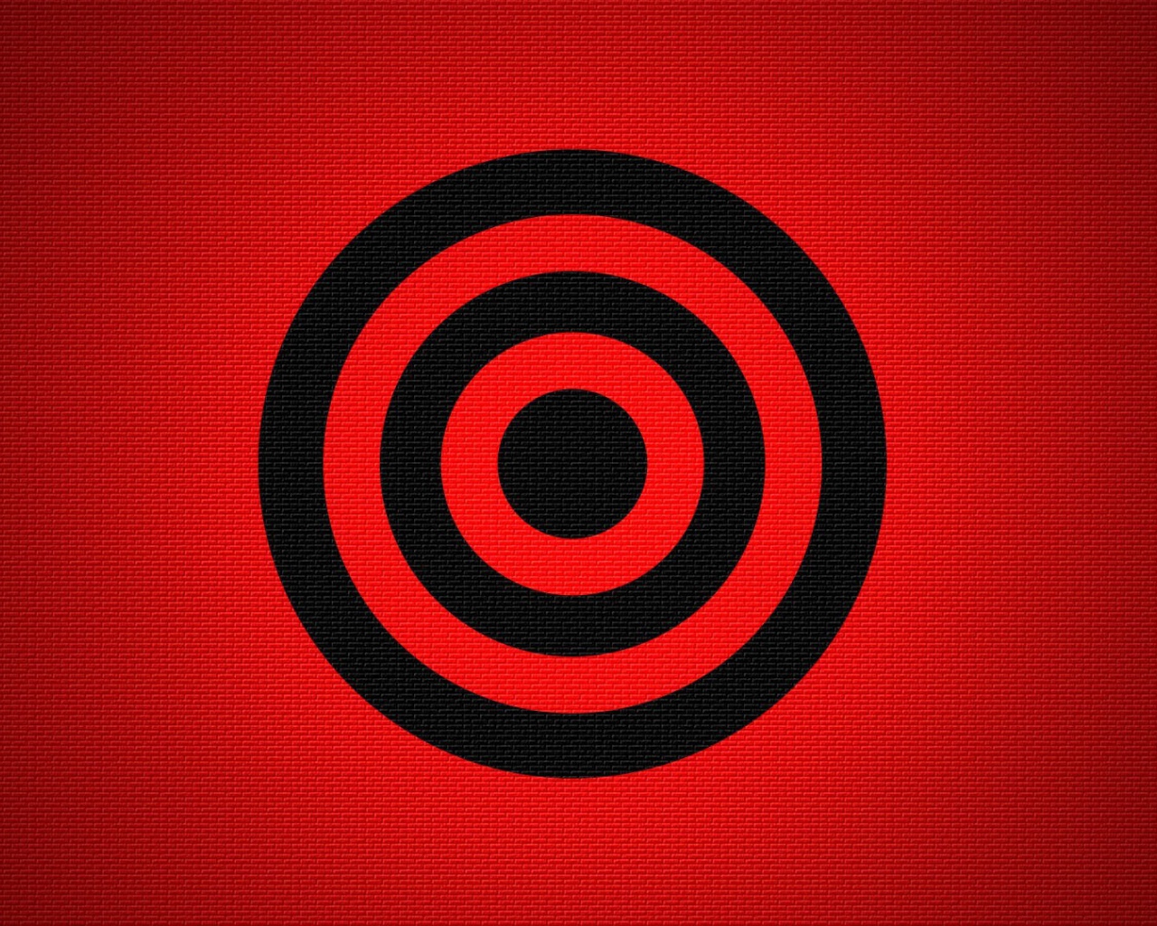 Черная мишень на красном фоне