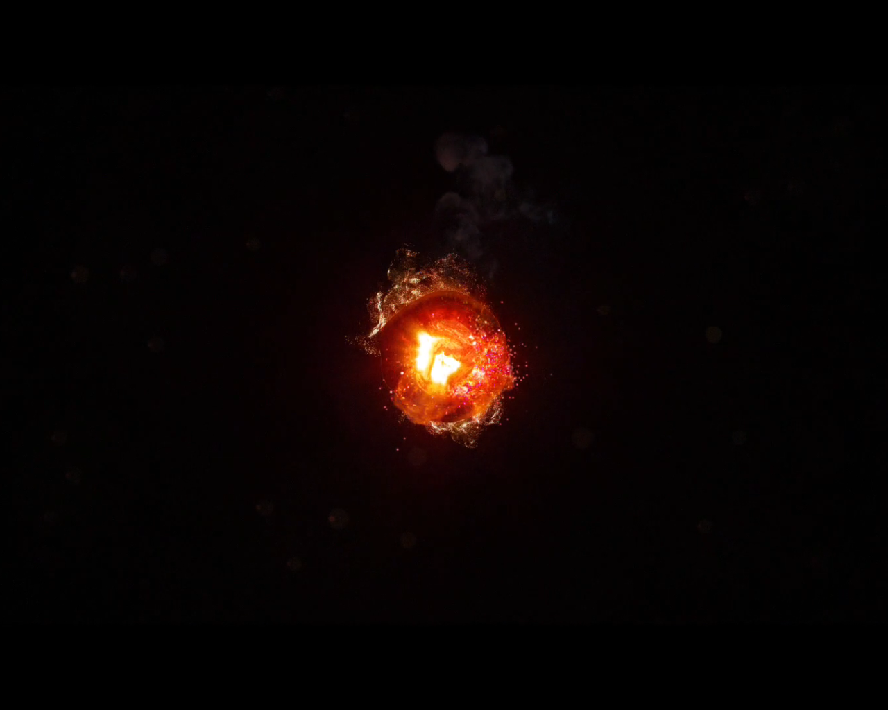 Горящий уголек, черный фон