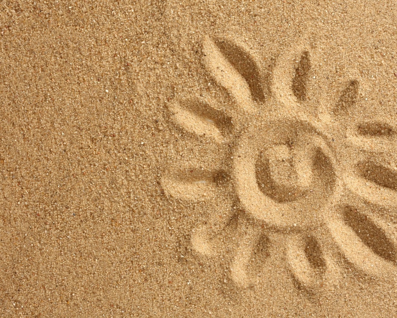 Рисунок солнца на песке