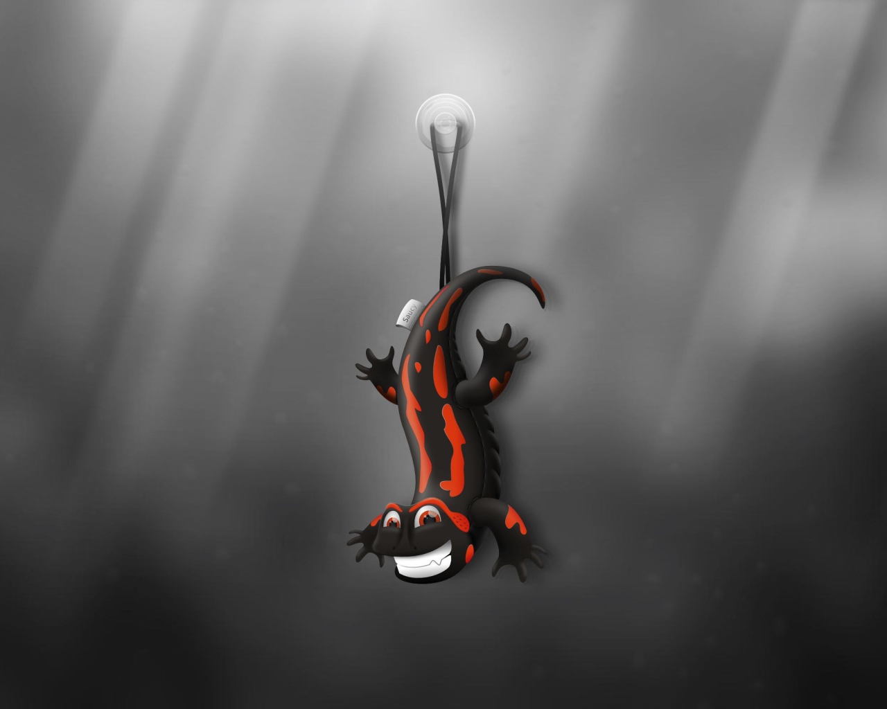 Ящерица игрушка, серый фон