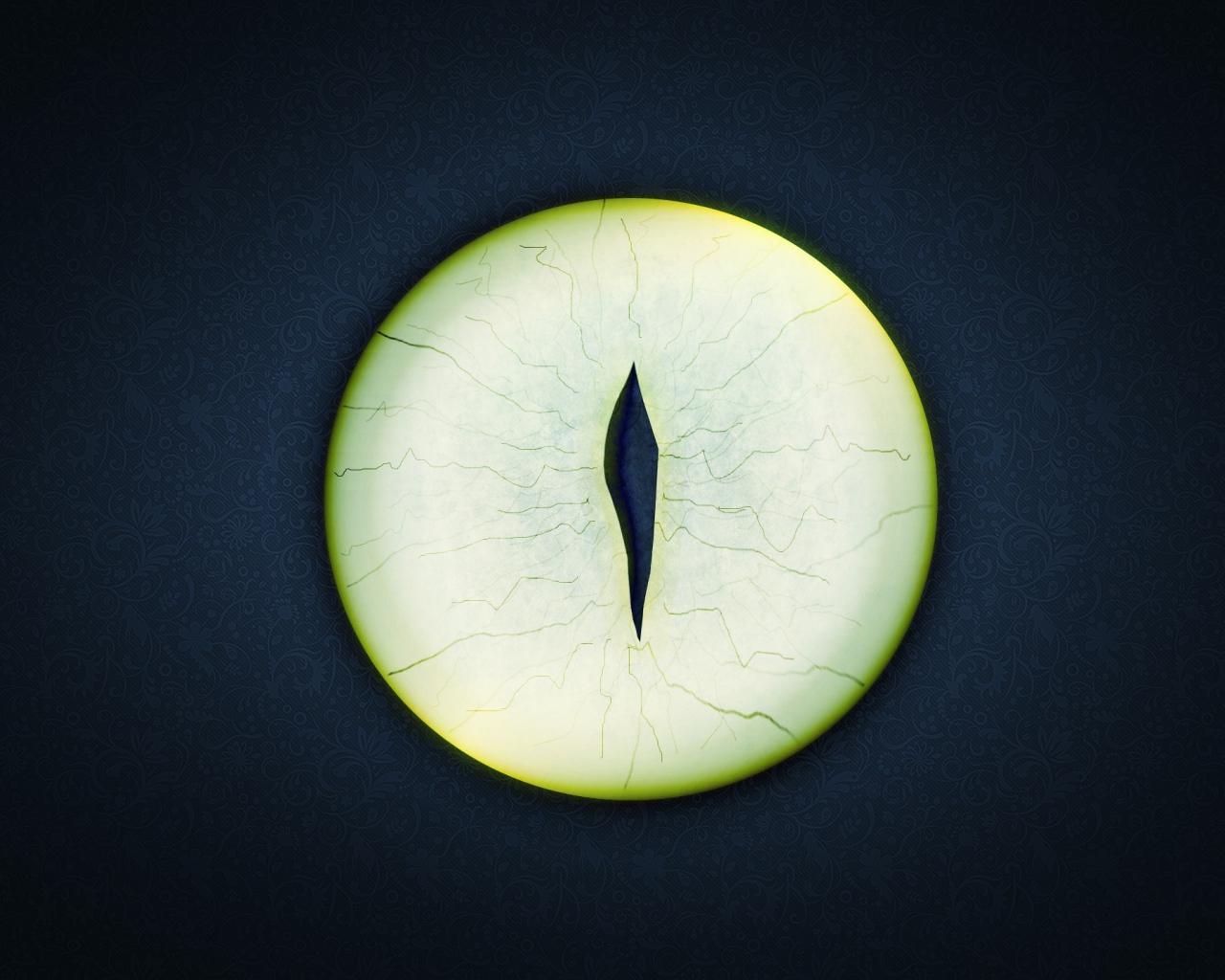 Круглый зеленый глаз на черном фоне