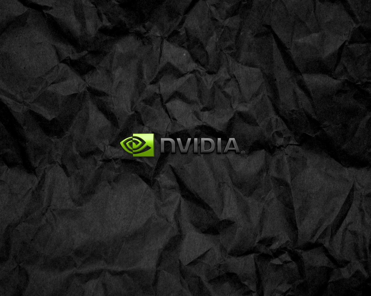 Символика Nvidia на мятой черной бумаге