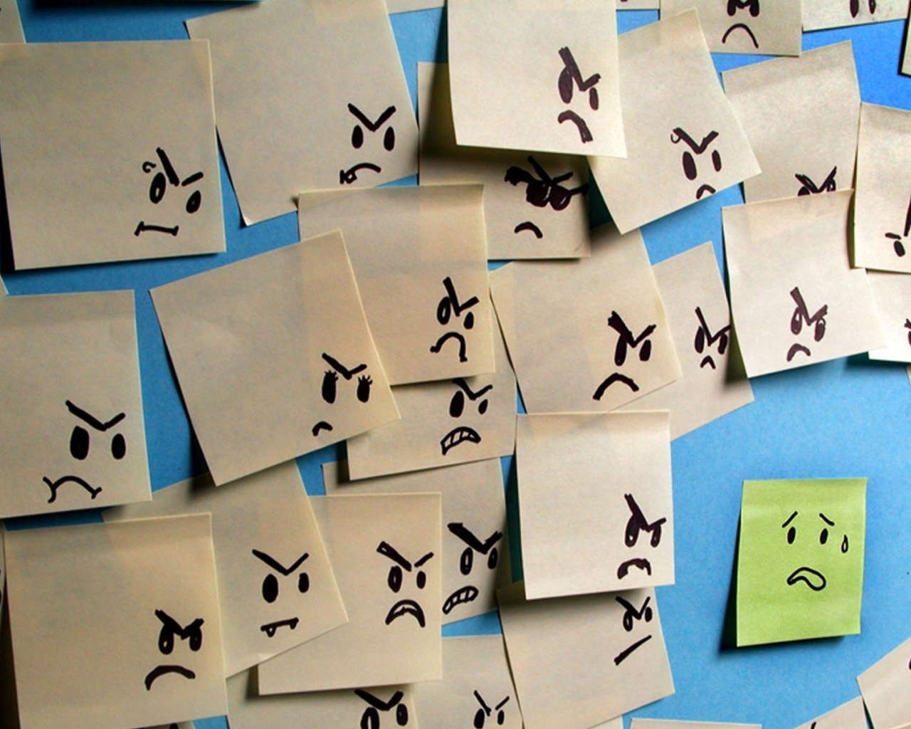 Испуганный стикер в окружении злых стикеров