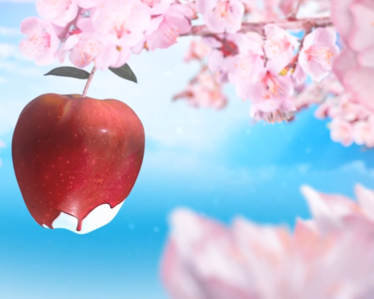 Красное яблоко среди розовых цветов