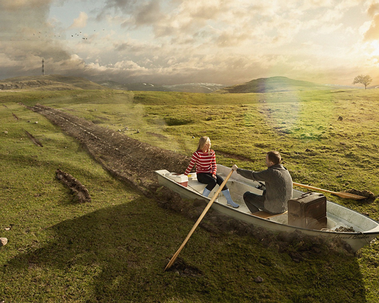 Двое в лодке среди поля