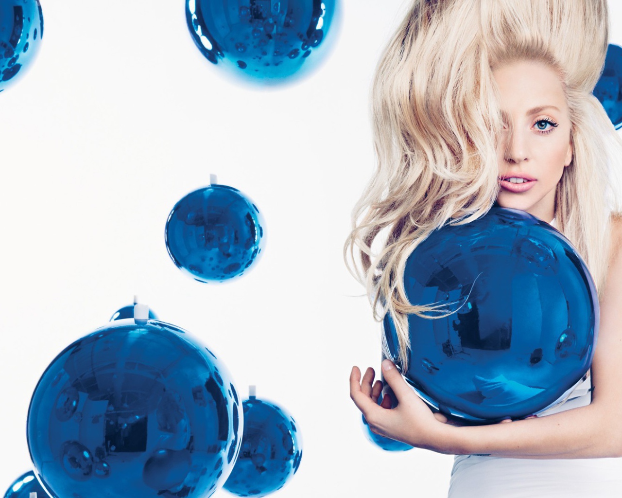 Girl among blue balls