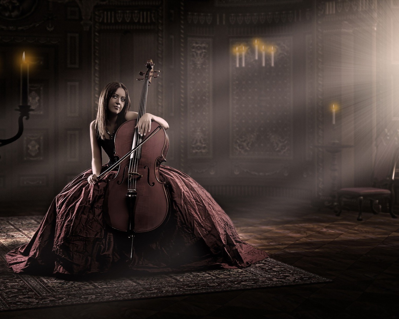 Девушка в роскошном платье играет на виолончели