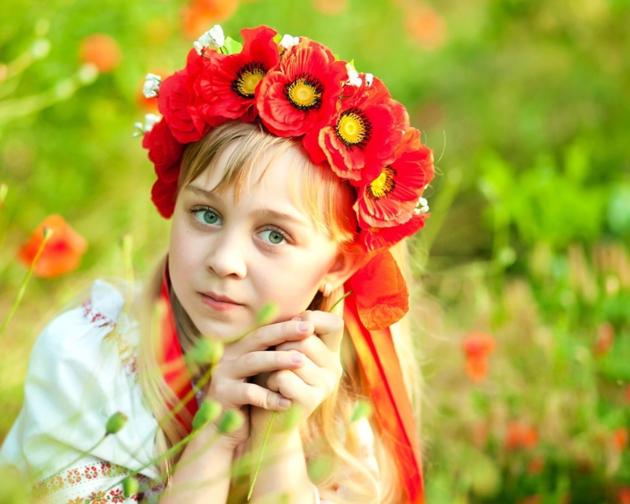 Girl in a wreath of poppies