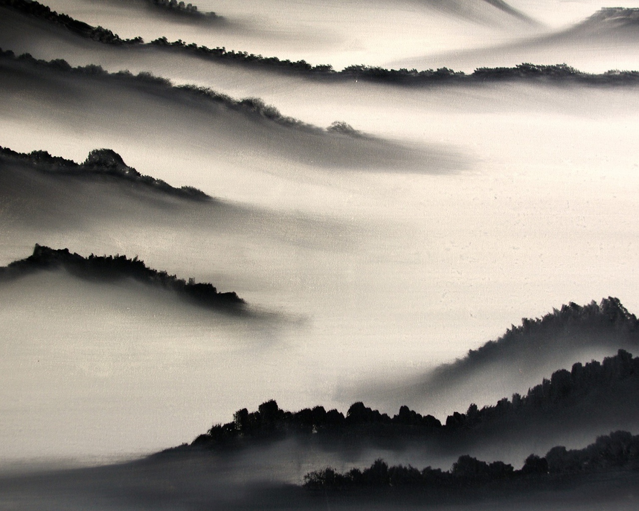 Hills in dense fog