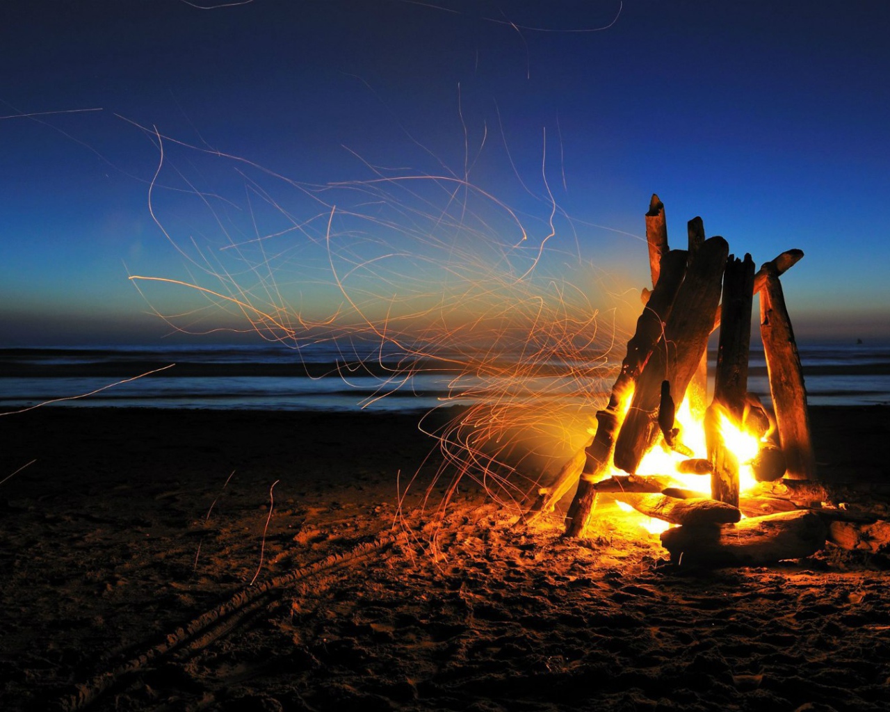 Bonfire in the sand on the beach