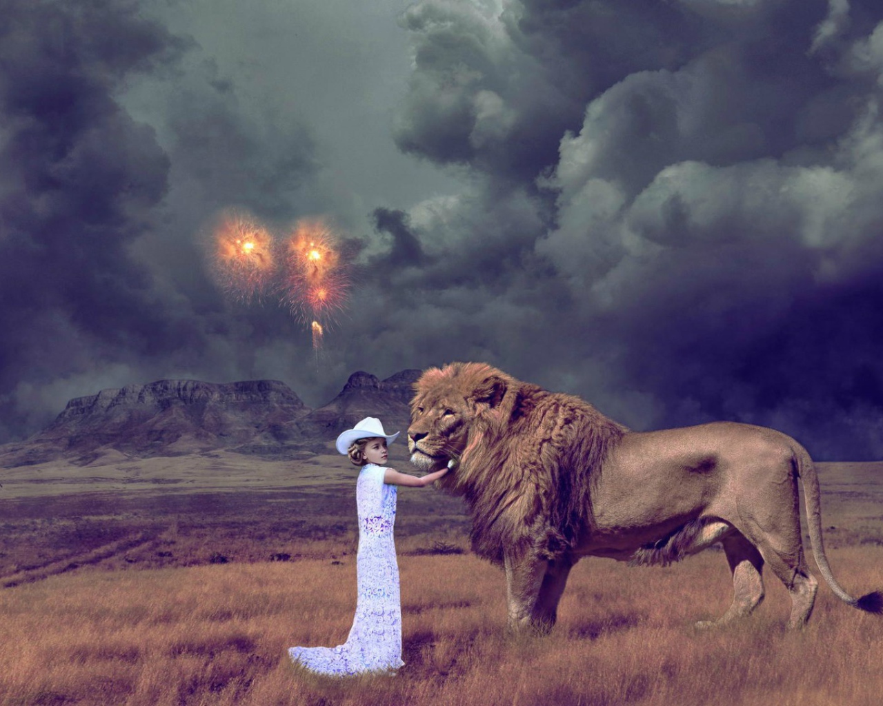 Девочка играет со львом