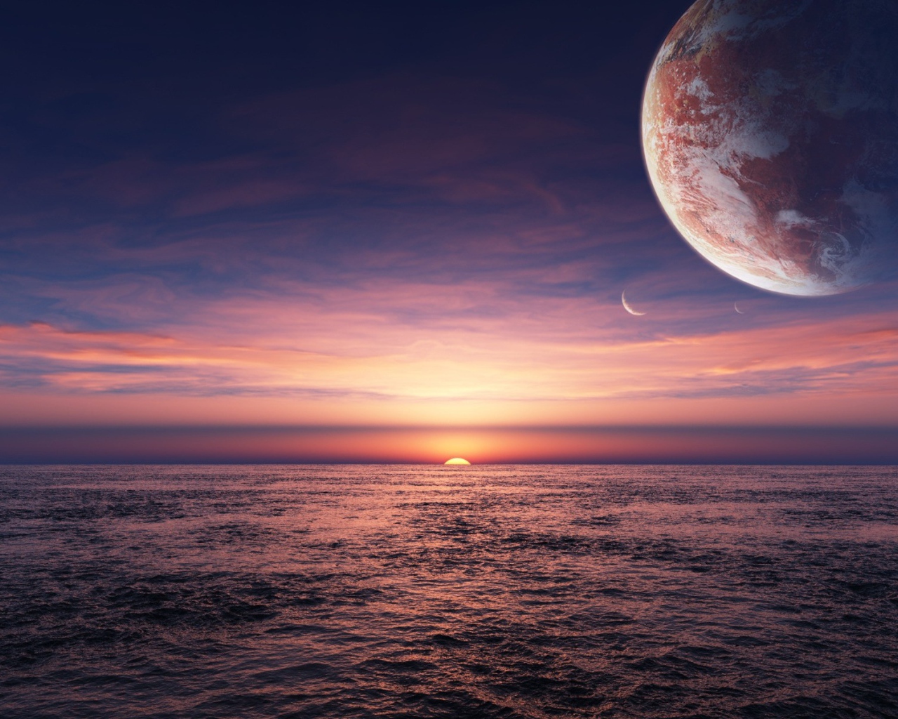 Планета в небе над закатом в океане