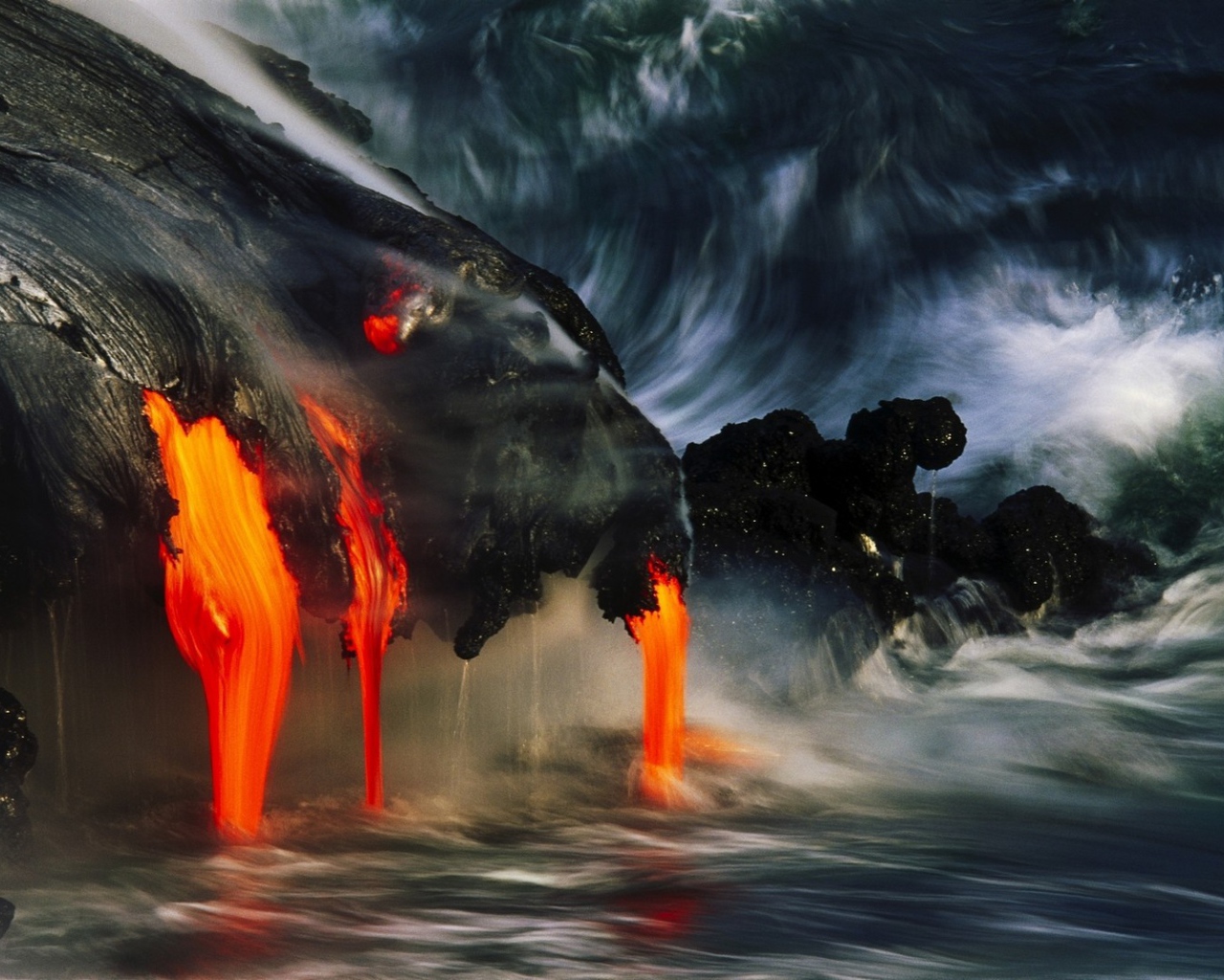 Lava flowing into the sea, Hawaii
