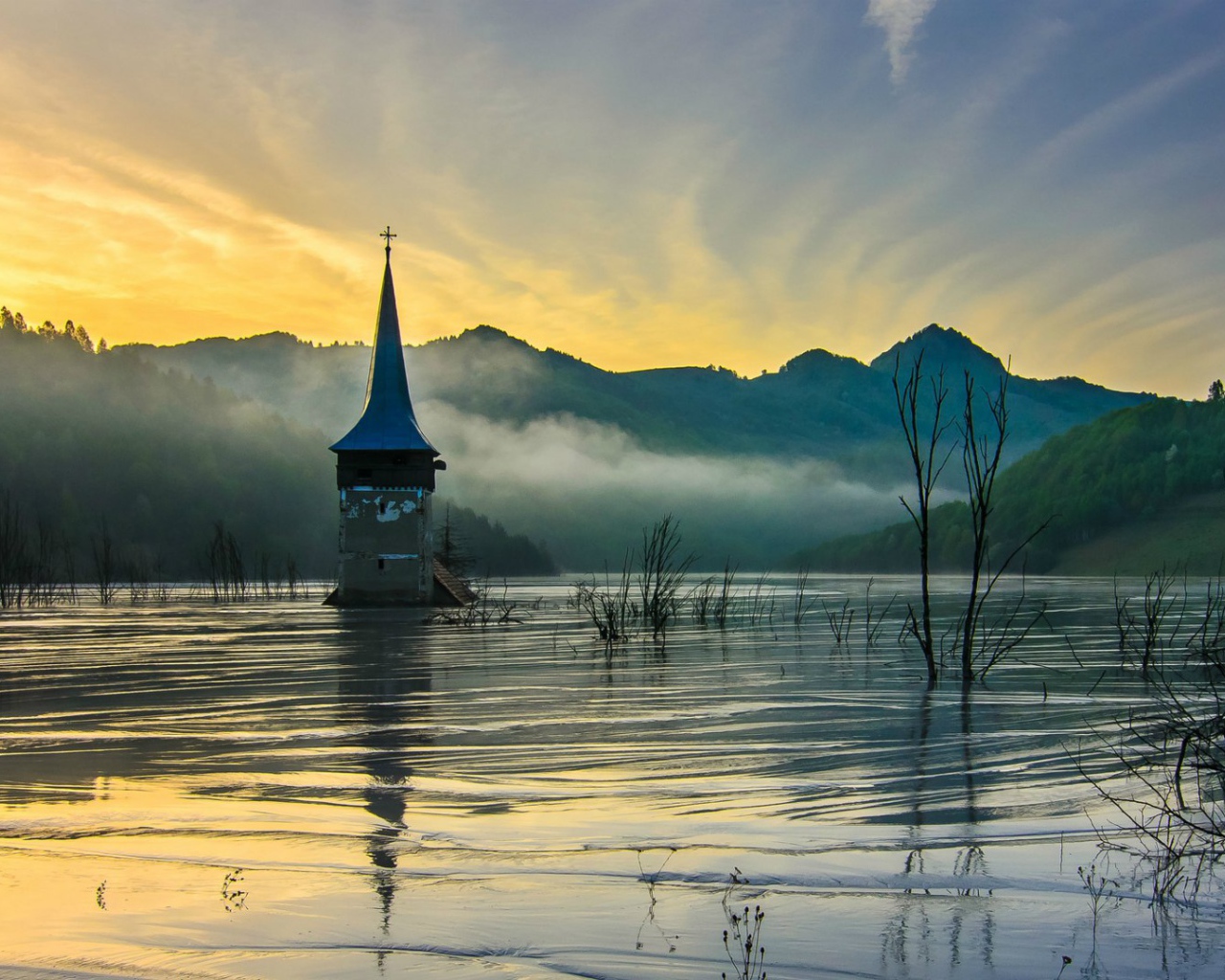 Flooded church at dawn. Romania