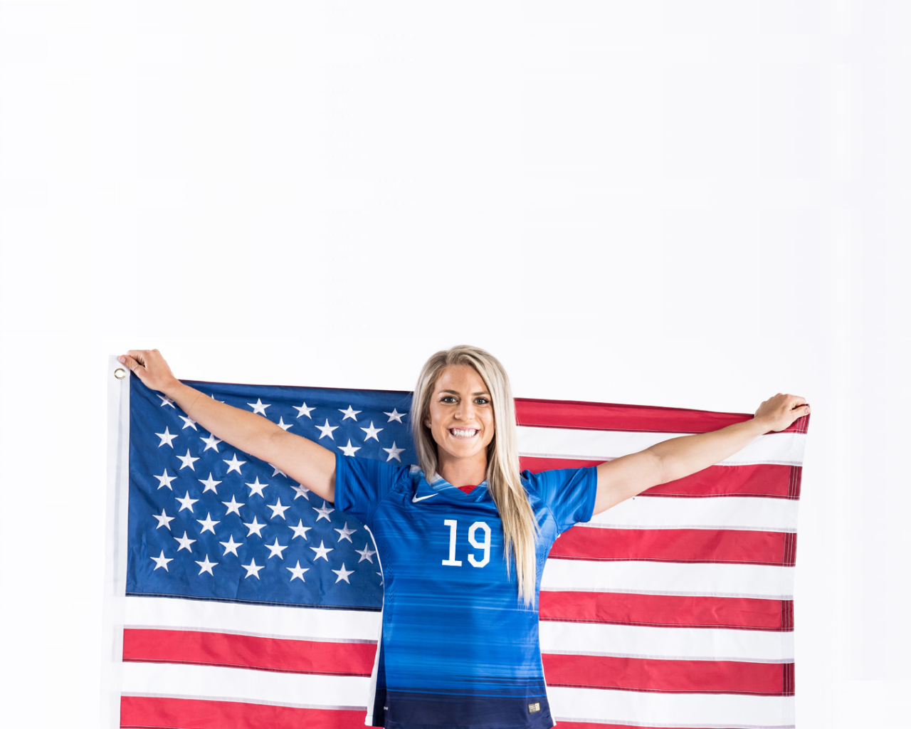 Girl athlete Julie Johnston with US flag