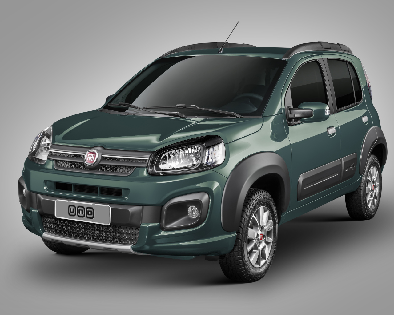 Зеленый автомобиль Fiat Uno Way на сером фоне