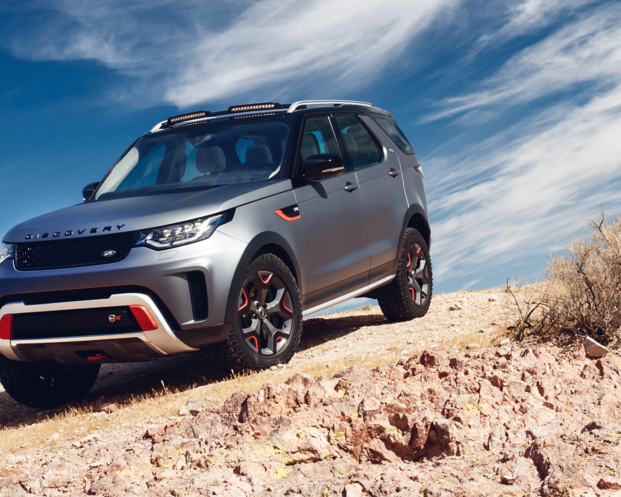 Silver SUV Land Rover Discovery SVX 2, 2018 against the sky