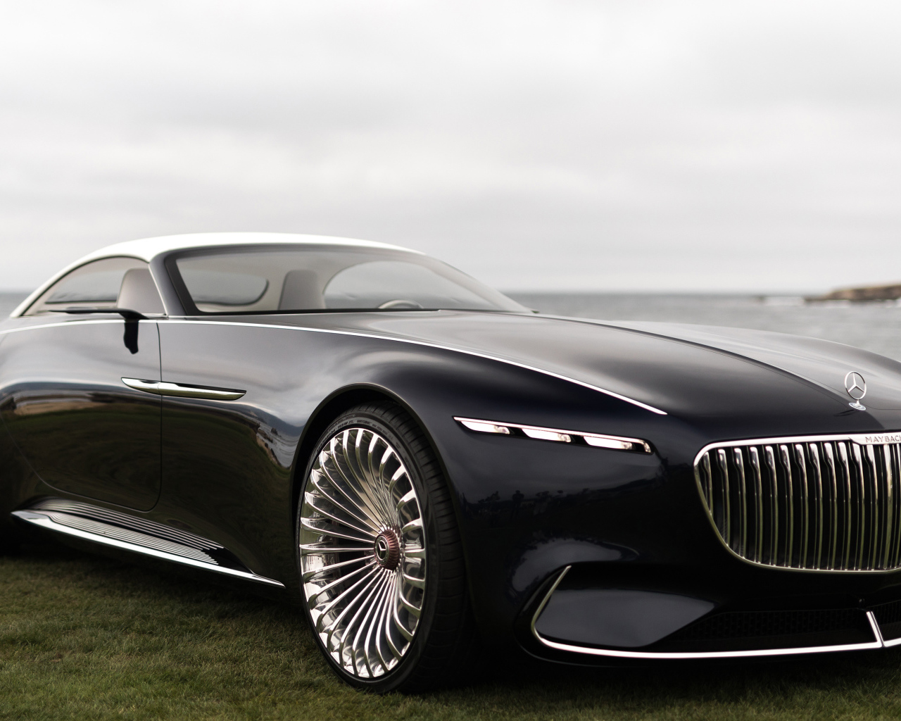 Black stylish car Vision Mercedes-Maybach 6 Cabriolet, 2018 near the water