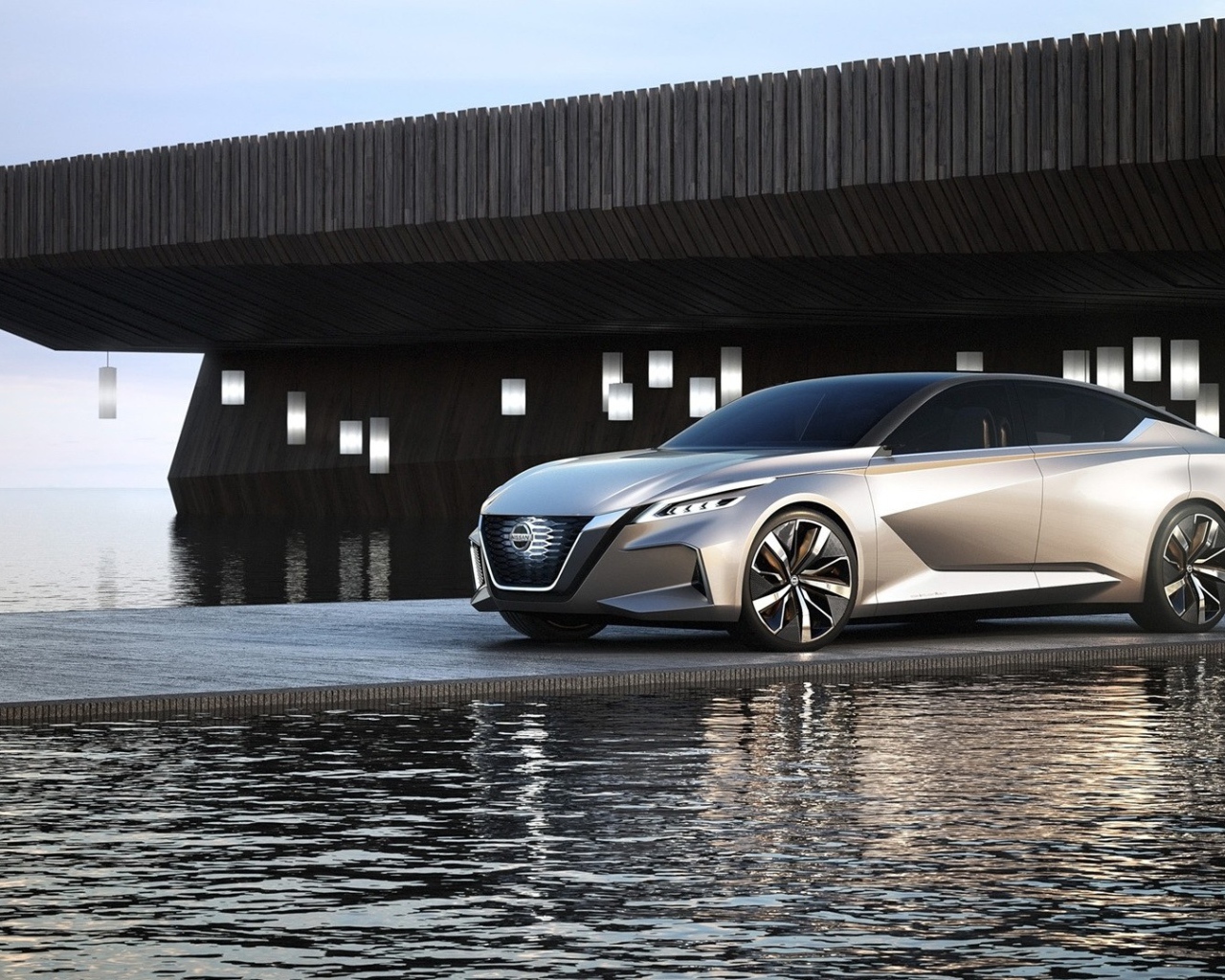 Серебристый автомобиль Nissan Vmotion 2.0 Concept, 2017 у воды 