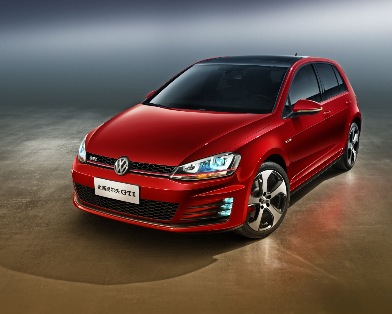 Автомобиль Volkswagen Golf GTI красного цвета 