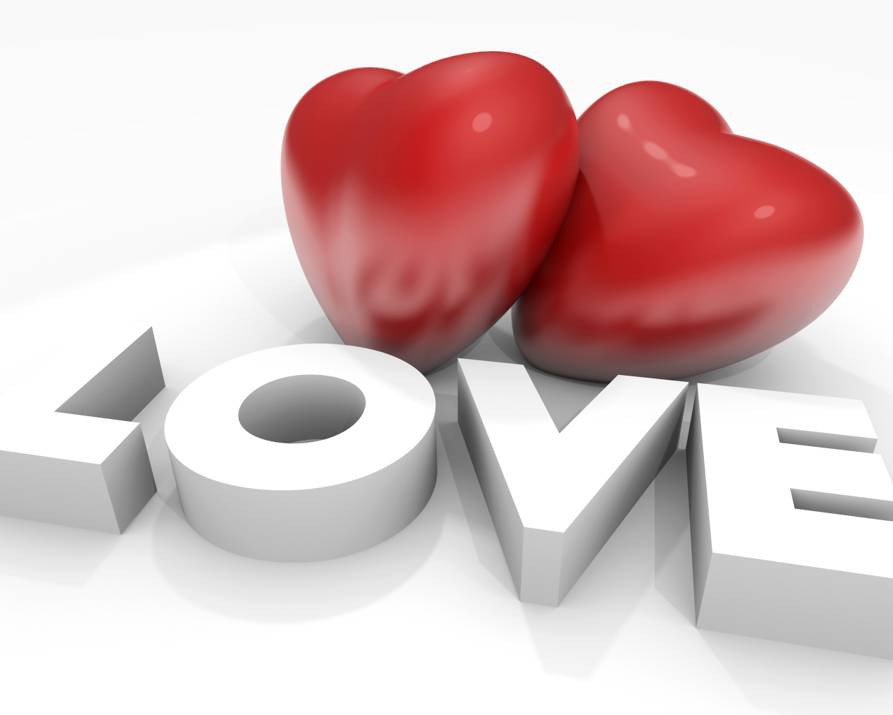 Два больших красных сердца с надписью Любовь на белом фоне, на 14 февраля