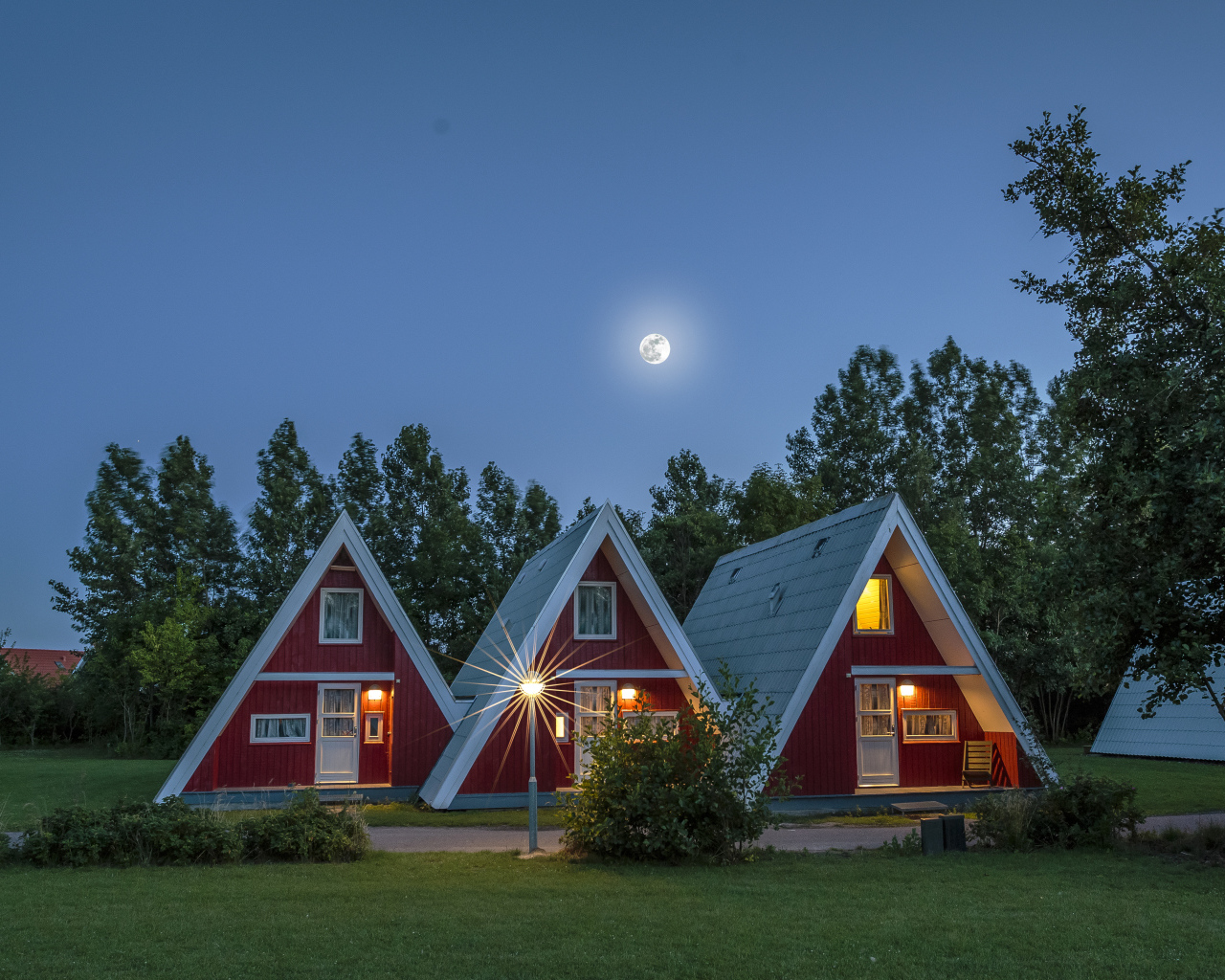 Unusual triangular houses under the night sky, Germany