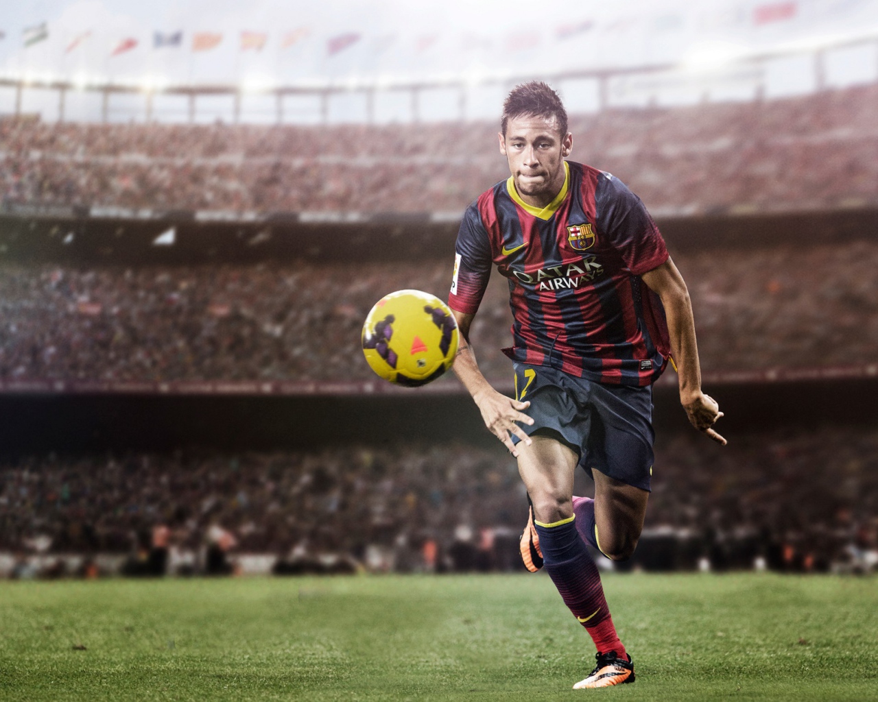 Футболист Неймар на футбольном поле с мячом