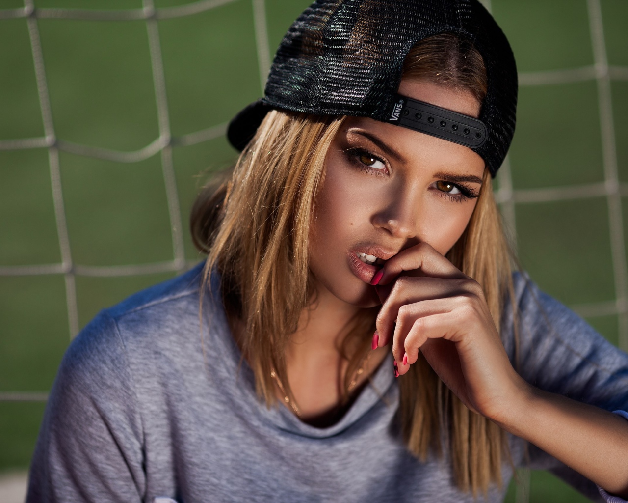 Girl athlete in a black cap