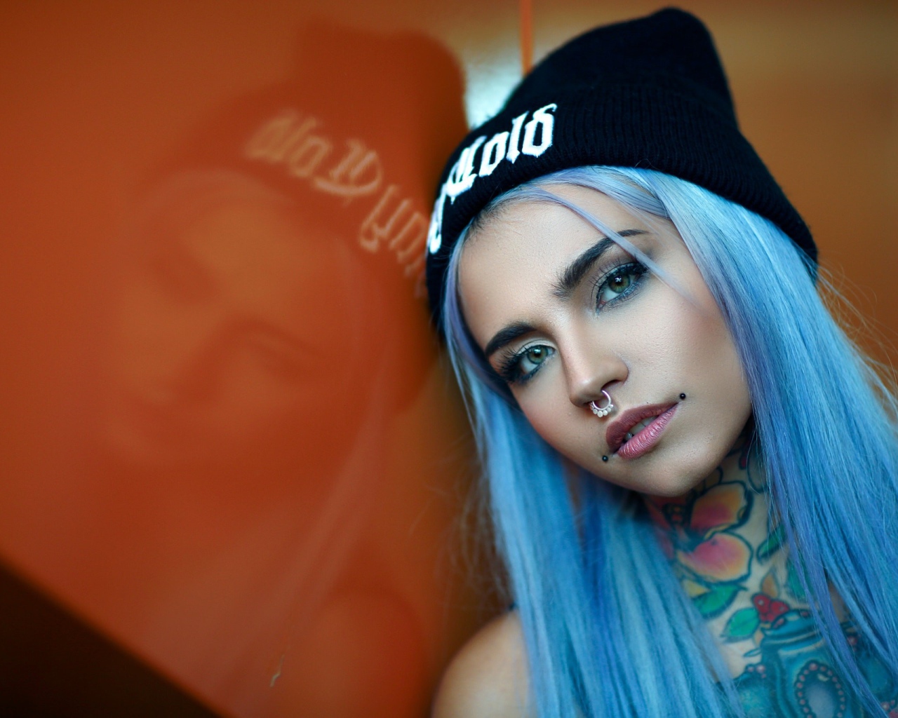 Girl with blue hair and piercing in the nose