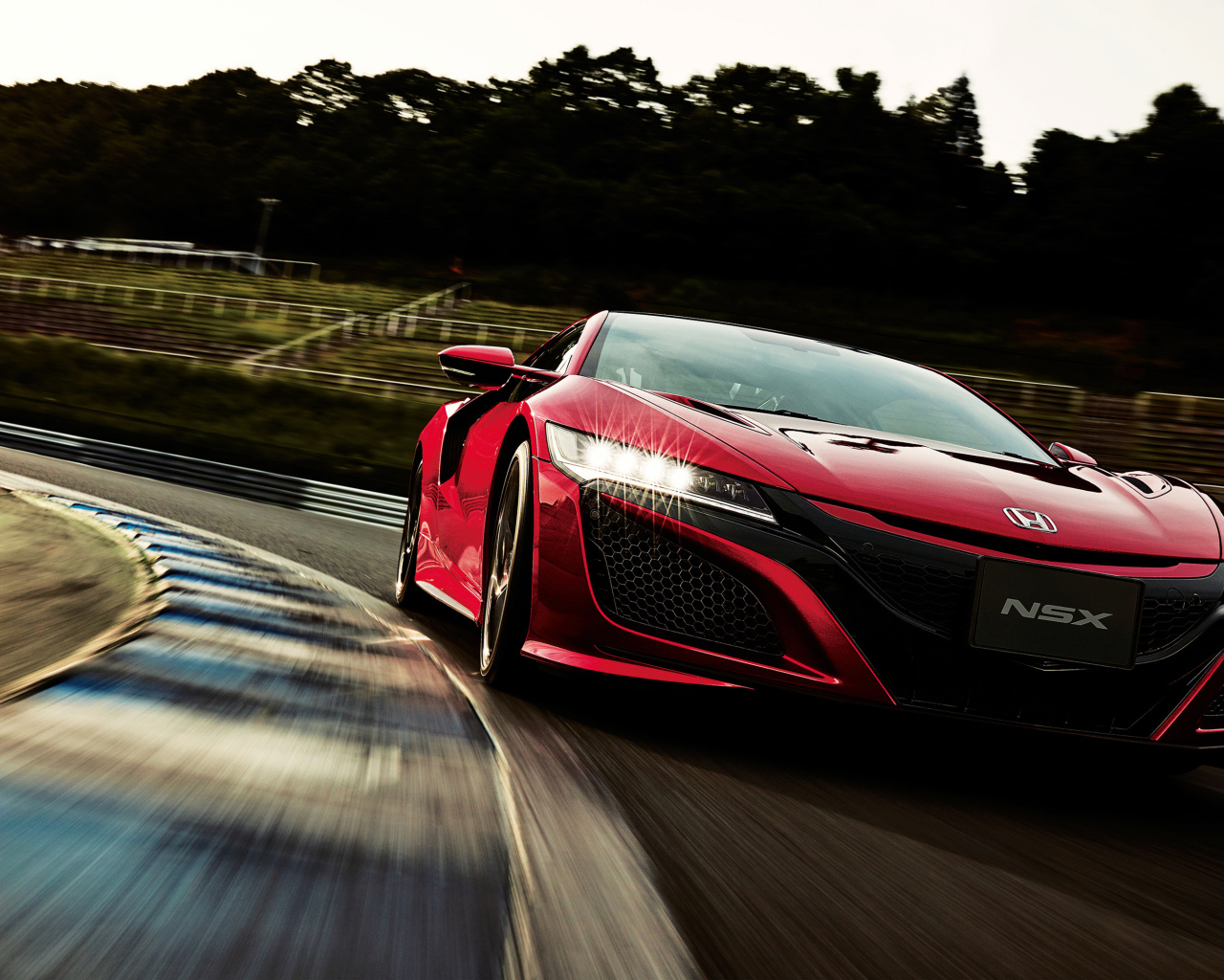 Red Honda NSX car on the track