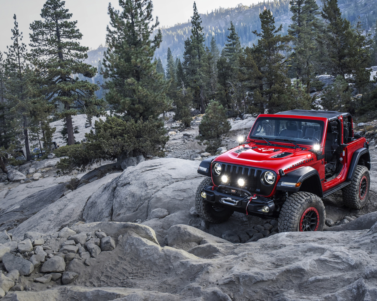 Красный внедорожник  Jeep Wrangler With Mopar, 2018 года в горах 