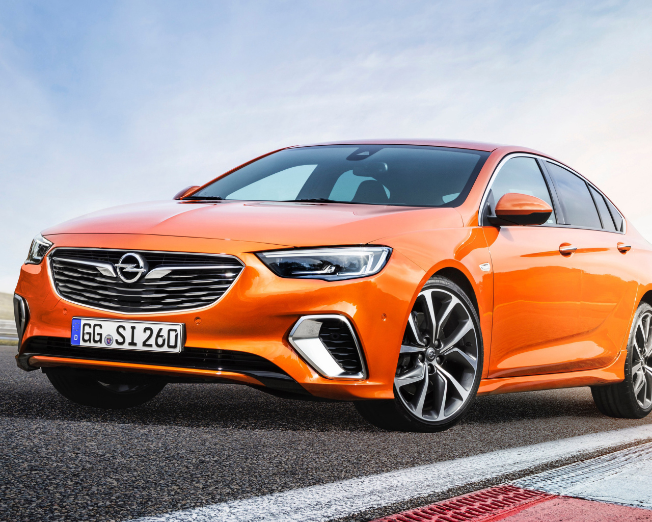 Orange car Opel Insignia GSi, 2018 on the road