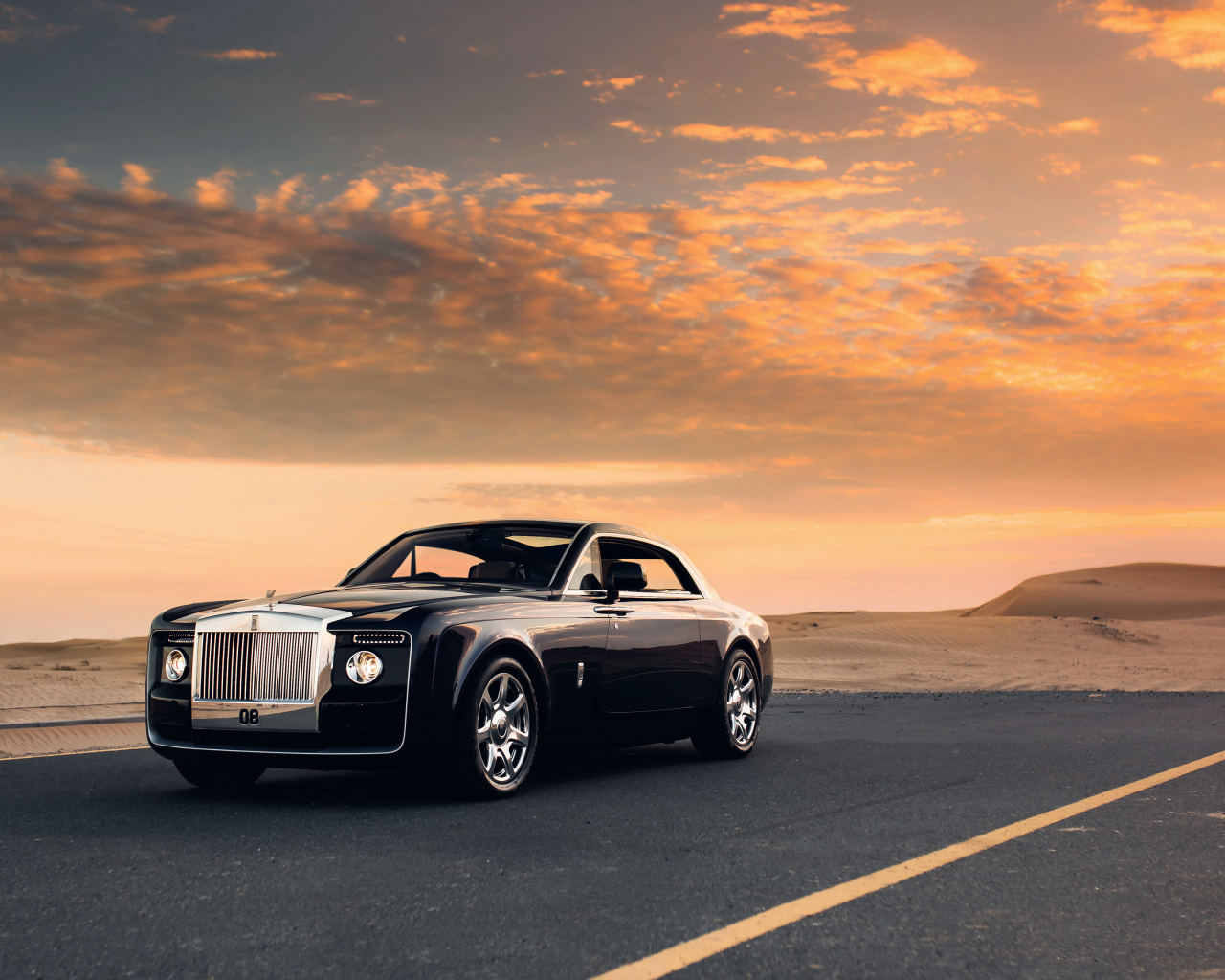 Black Rolls Royce Sweptail on a background of beautiful sky