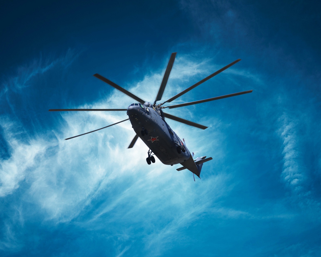 Military helicopter Mil Mi-26 in the blue sky