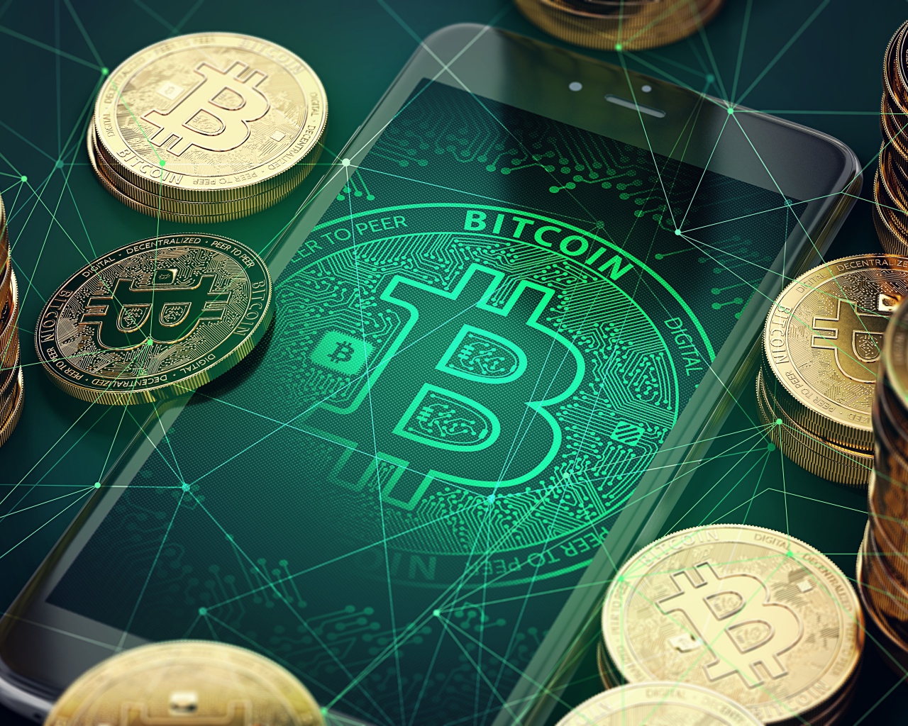 Монеты биткоин со смартфоном на столе 