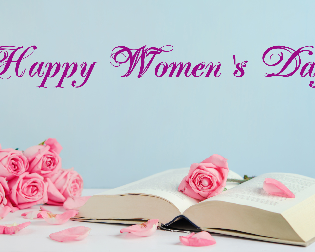 Open book and pink roses for International Women's Day