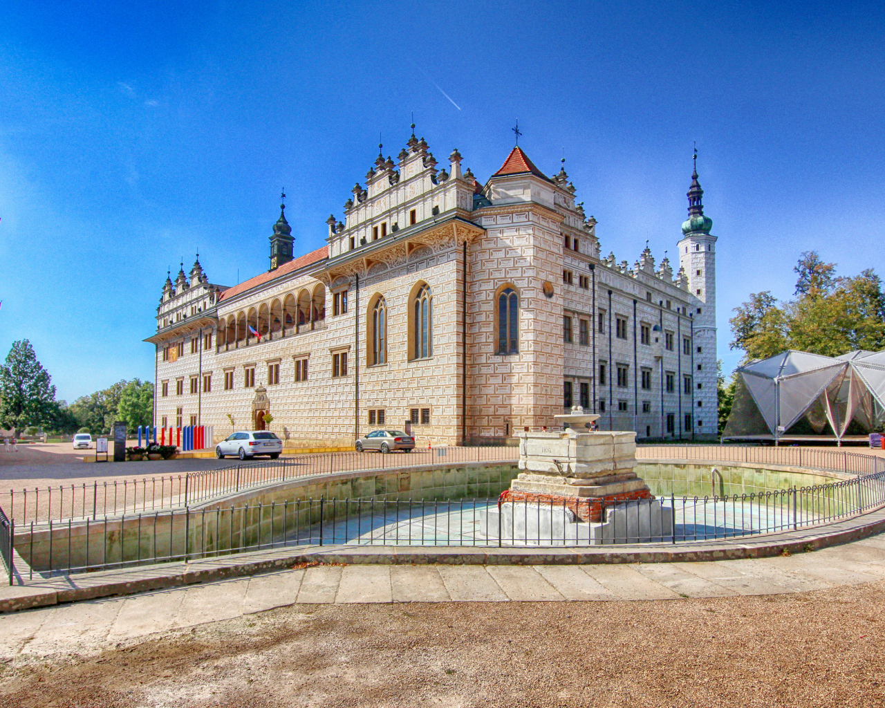 Litomyšl Castle with a fountain under the blue sky, Czech Republic