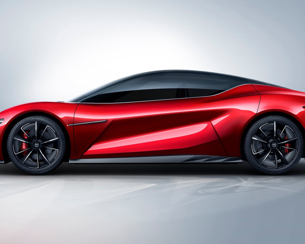 Красный автомобиль BYD E-SEED GT 2019 года на сером фоне