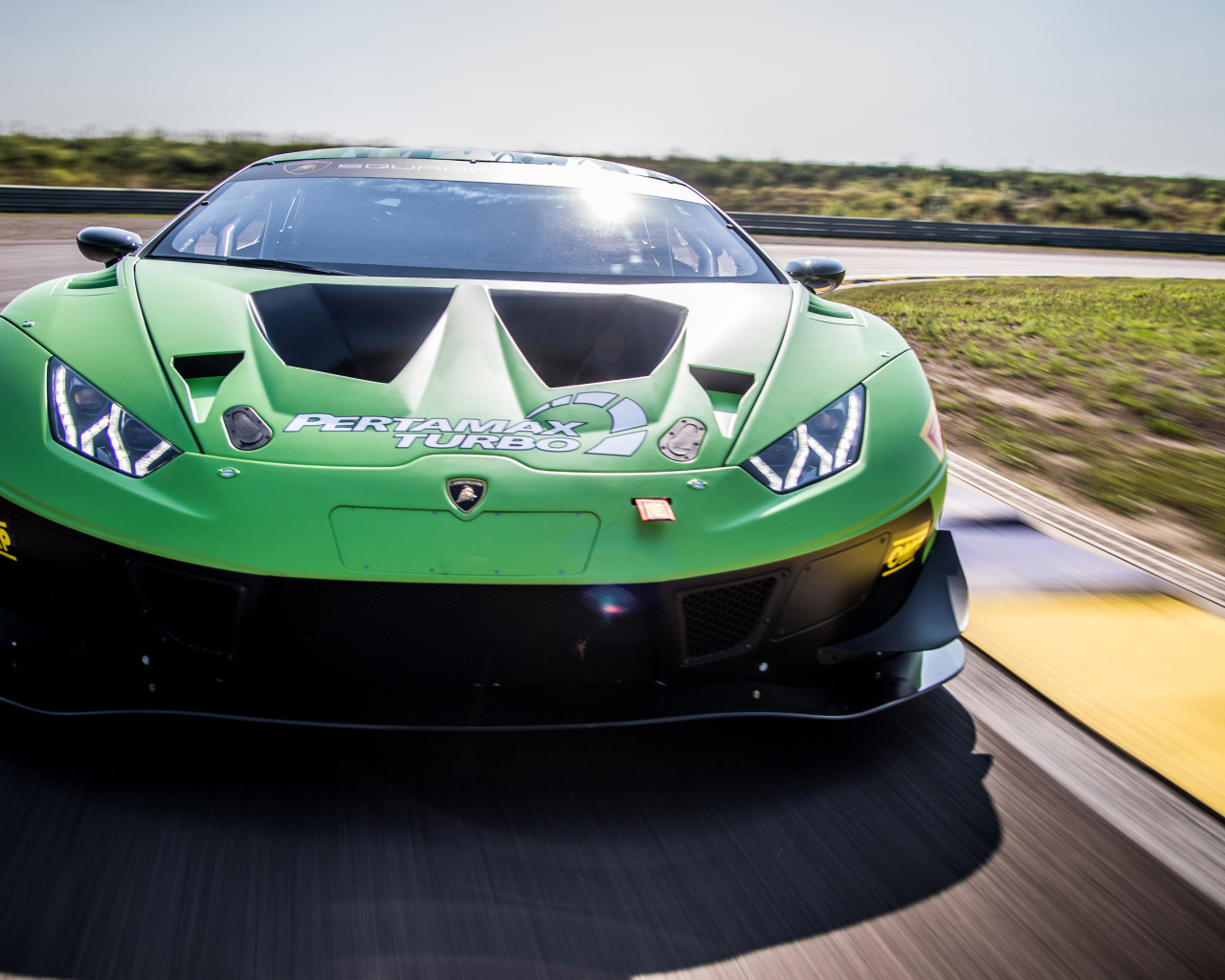 Green sports car Lamborghini Huracan GT3 EVO 2018 on the track