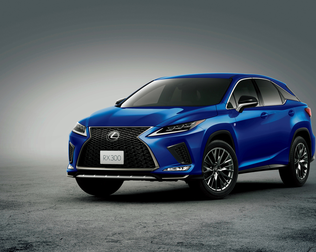 Синий автомобиль Lexus RX 300 F SPORT 2019 года на сером фоне